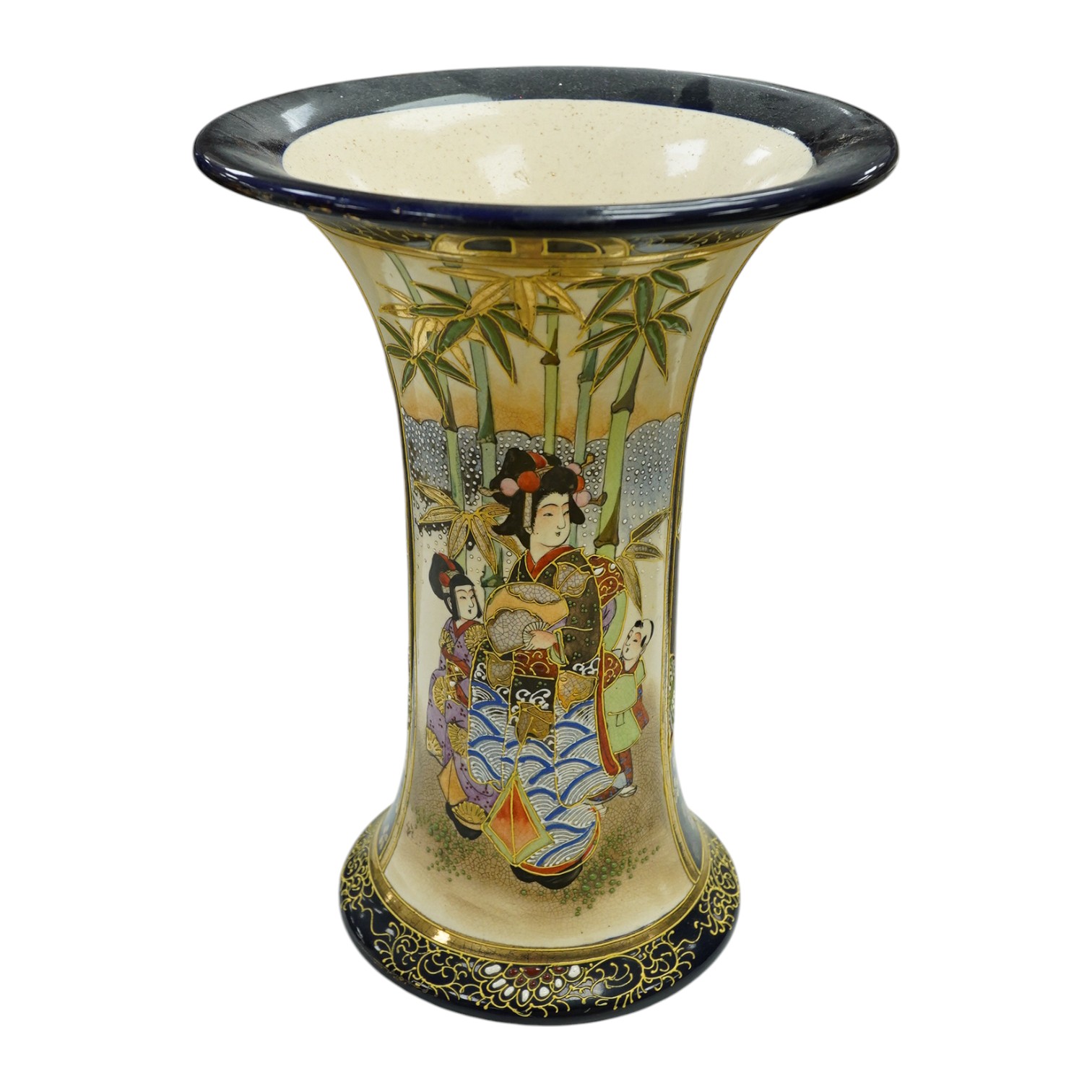 A 20th century Japanese Satsuma pottery trumpet vase decorated with figures, 32cm high. Condition - crazed